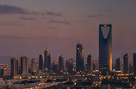 A city skyline at dusk.